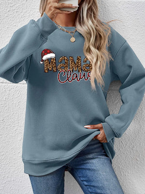 French Blue crewneck sweatshirt with leopard print "Mama Claus" graphic and Santa hat detail.