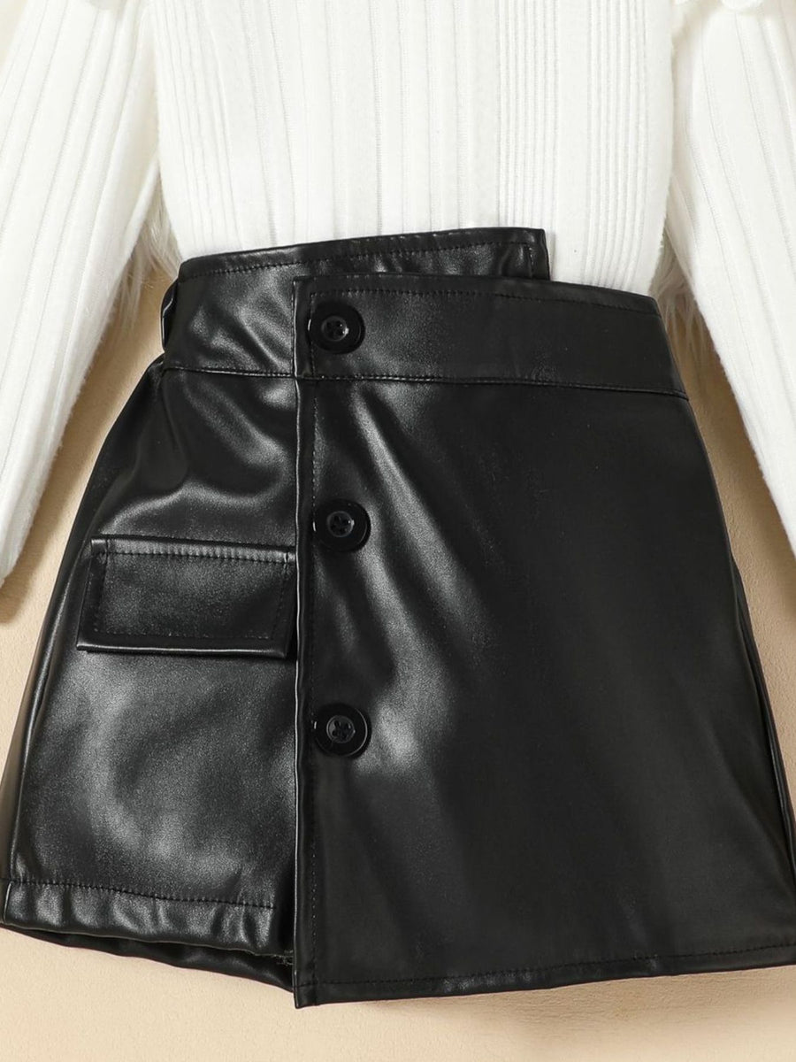 Black leather skirt with button front and pocket detail, paired with a ribbed knit top.