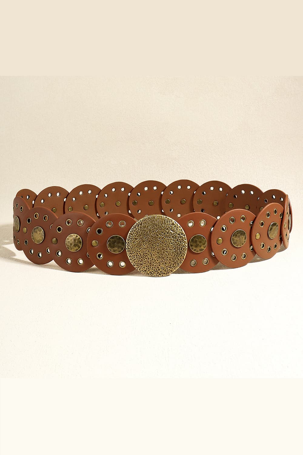 Brown faux leather belt with disc embellishments and brass-tone studs