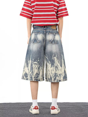 Men's wide-leg denim shorts with abstract bleach pattern and pockets