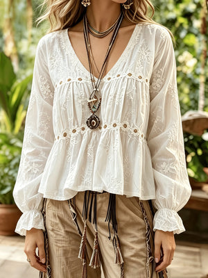 White blouse featuring embroidered and floral