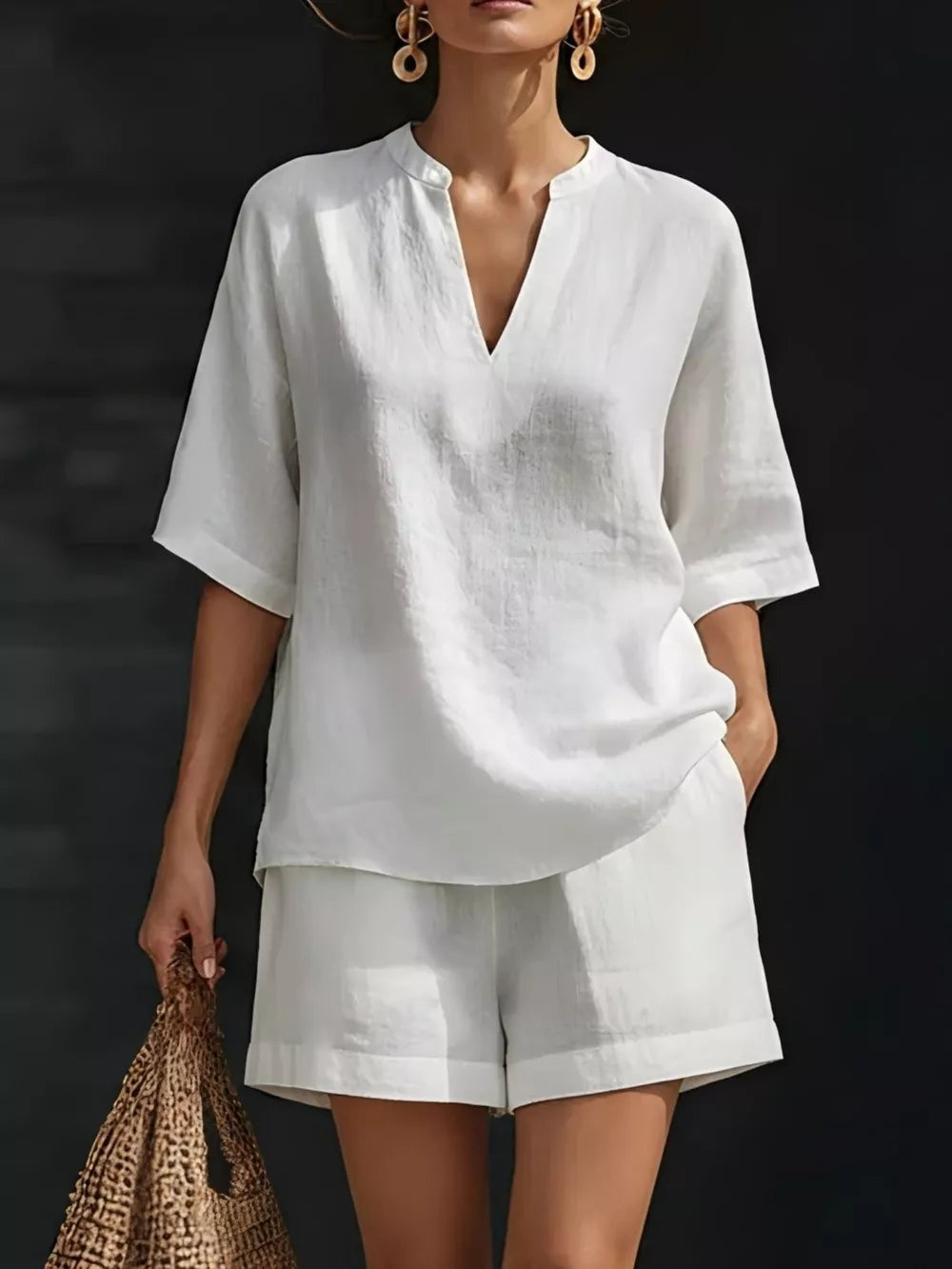 White notched V-neck two-piece set with pockets and cuffed shorts