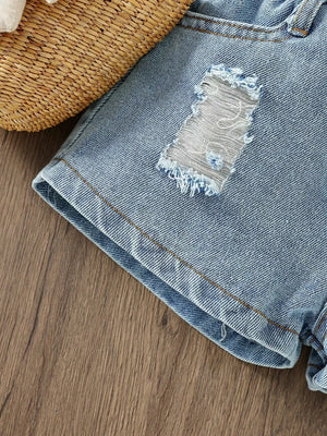Toddler denim shorts with distressed patch detail and frayed hem.