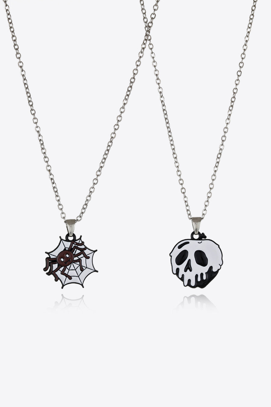 Spooky Season enamel pendant set with spiderweb and skull charms on silver chains.