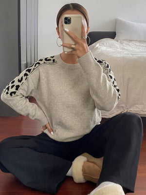 black pullover sweater featuring ribbed and leopard