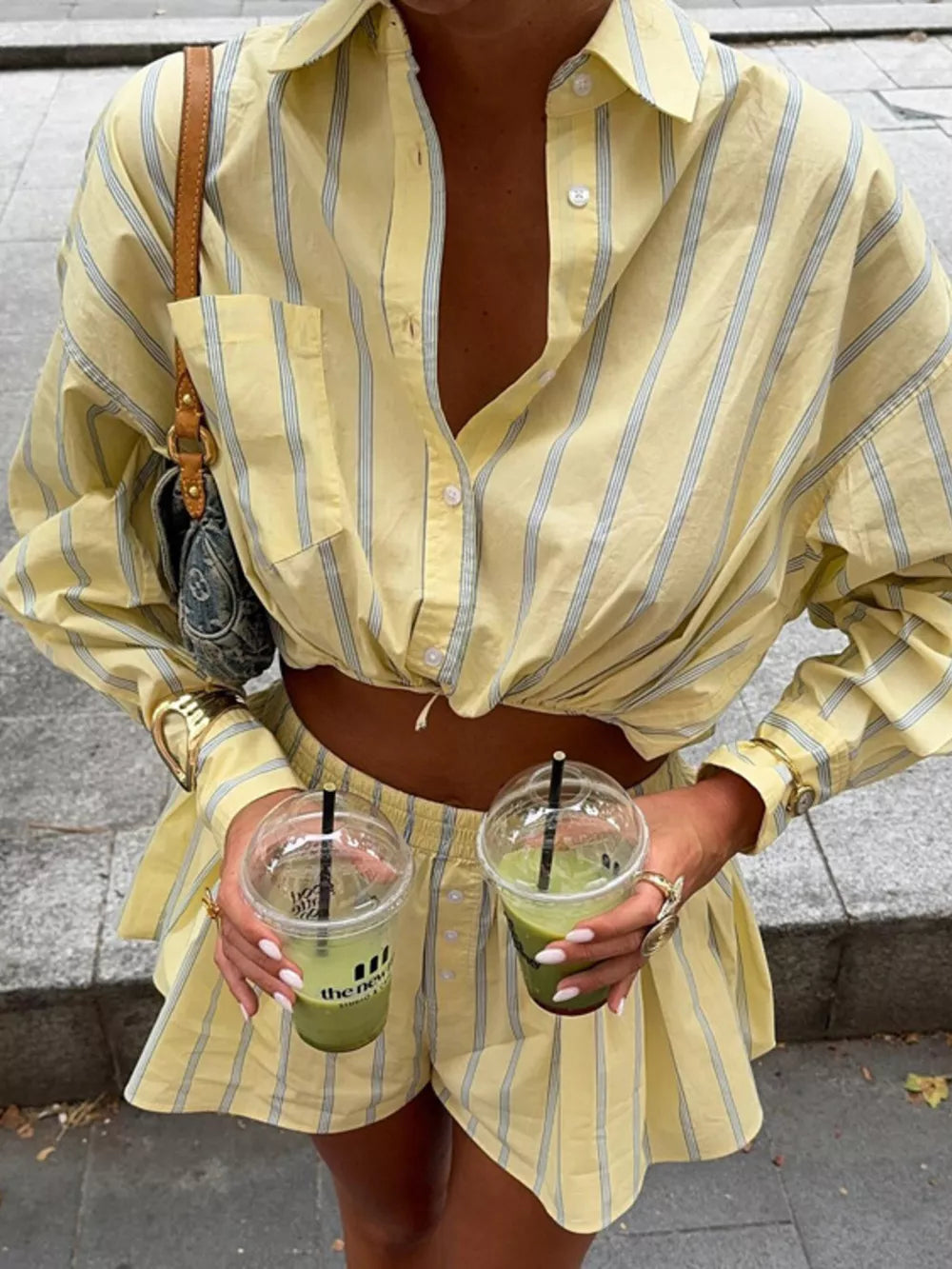 Yellow striped cotton pajama set with a cropped button-up shirt and matching shorts.