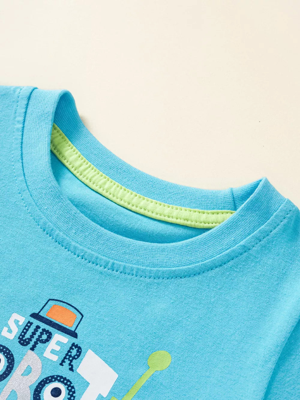 Blue cotton baby tee with "SUPER ROBOT" graphic and lime green neck trim.