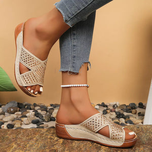 Off-white rhinestone-embellished open toe wedge sandals with criss-cross straps.