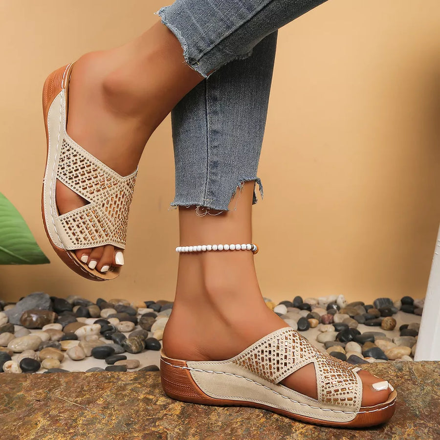 Off-white rhinestone-embellished open toe wedge sandals with criss-cross straps.