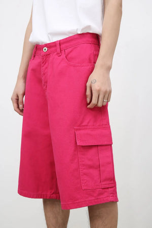 Magenta baggy cargo bermuda shorts with buttoned flap pockets.