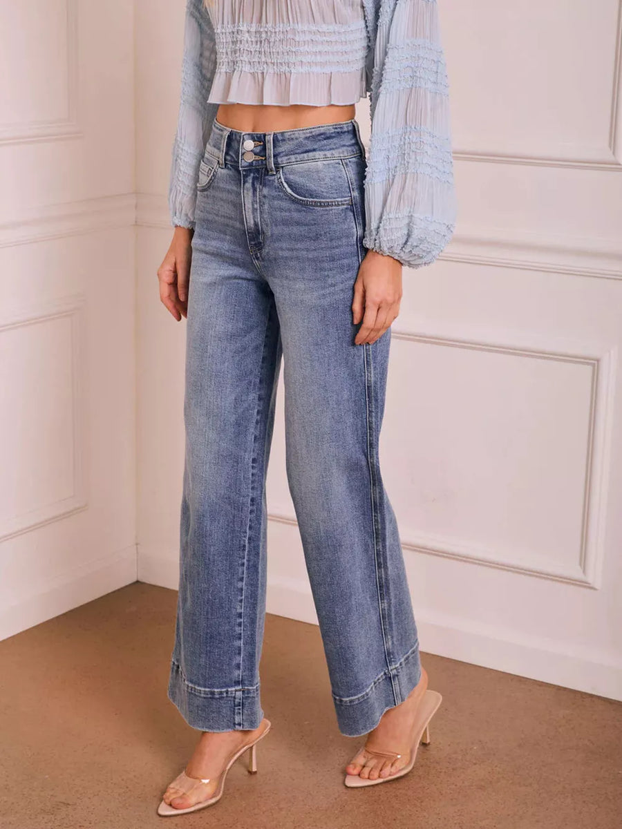 50%cotton, 50%spandex Care instructions: Machine wash cold wide-leg jeans in medium blue with flared silhouette