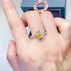 Silver ring with yellow diamond swirl and pave band