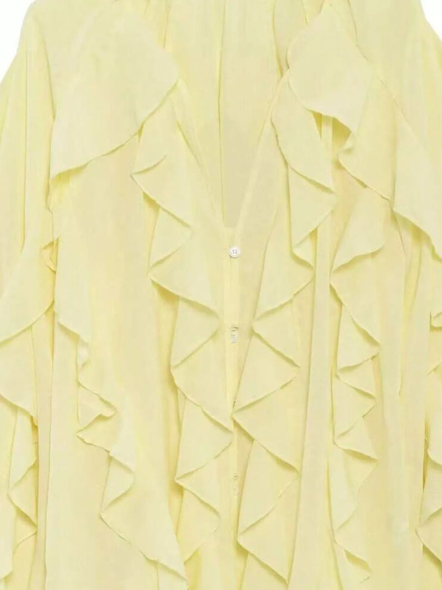 Yellow sheer long-sleeve blouse with cascading ruffles and button front detail.