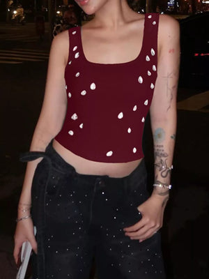 Burgundy cropped tank top with scattered white rhinestones and square neckline.
