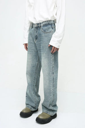 Baggy denim jeans in medium wash with subtle fade and relaxed fit.