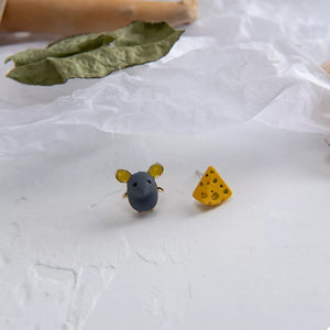 yellow earrings featuring asymmetrical design and novelty