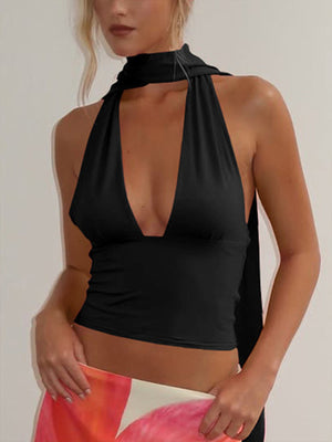 Black halter neck cami top with deep v-neck and adjustable ties.