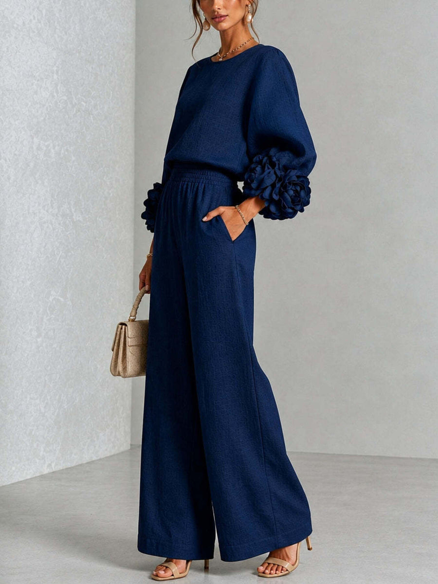 two-piece set in Black with pocketed and hip-length (top), full-length (pants)