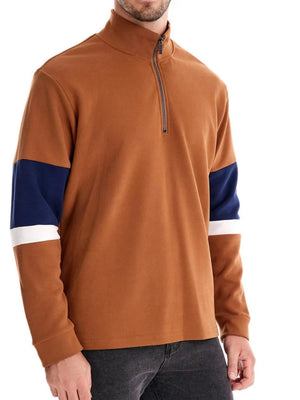 Colorblock zip-neck sweatshirt in caramel with navy and white sleeve details.