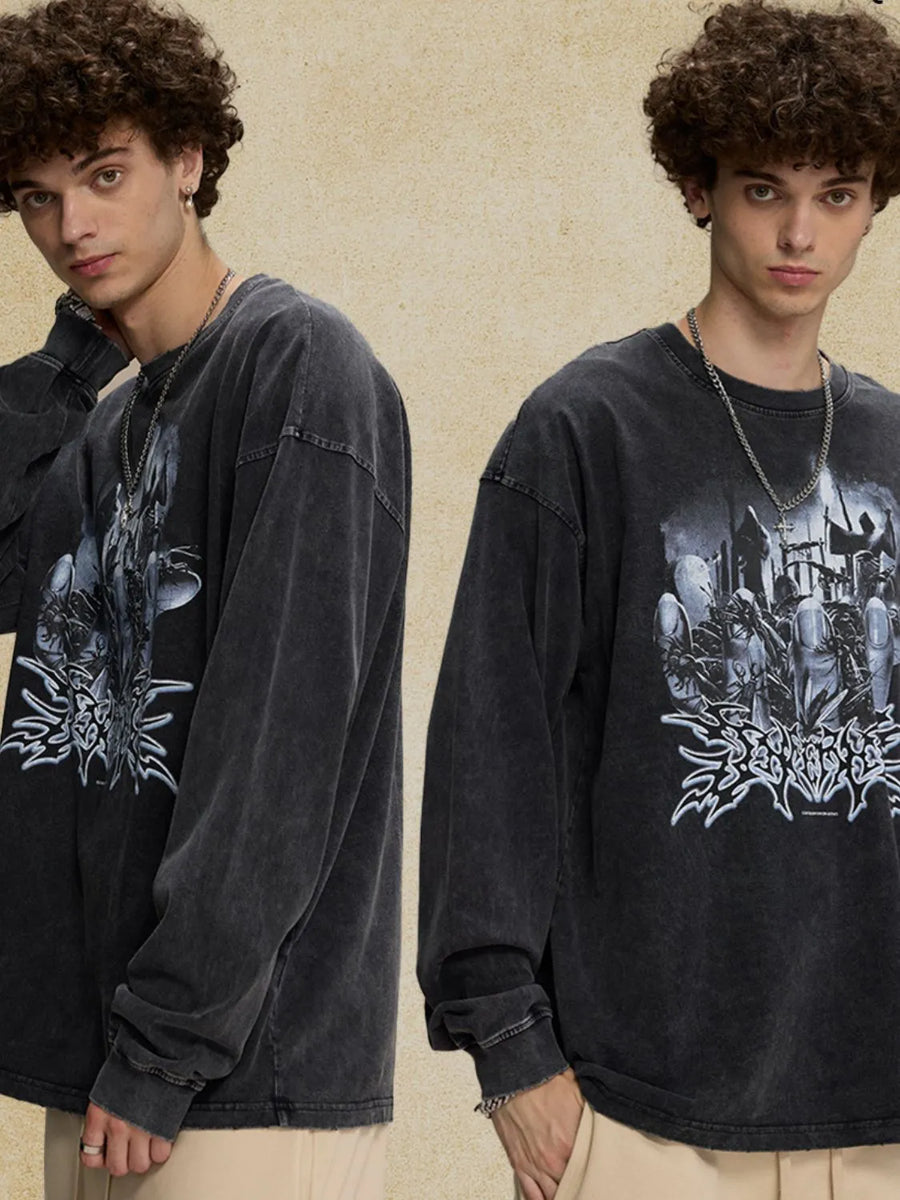 Washed black oversized long sleeve t-shirt with a bold graphic print on the front.
