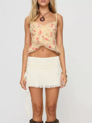 Floral lace trim cami top with a ruffled hem and floral print.