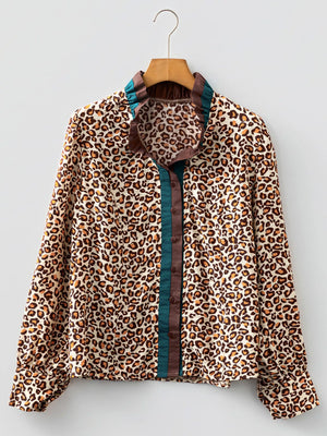 Leopard print button-down shirt with frilled collar and contrast trim.