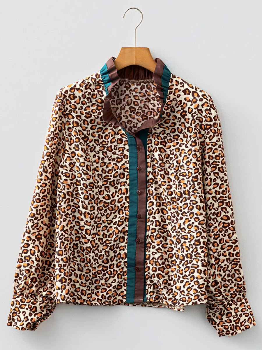 Leopard print button-down shirt with frilled collar and contrast trim.