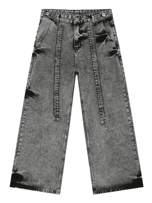 Dark gray acid wash denim jeans with exaggerated wide legs and a tie detail.
