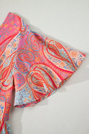 Paisley print short sleeve boho dress in burnt coral and pink with a V-neck.