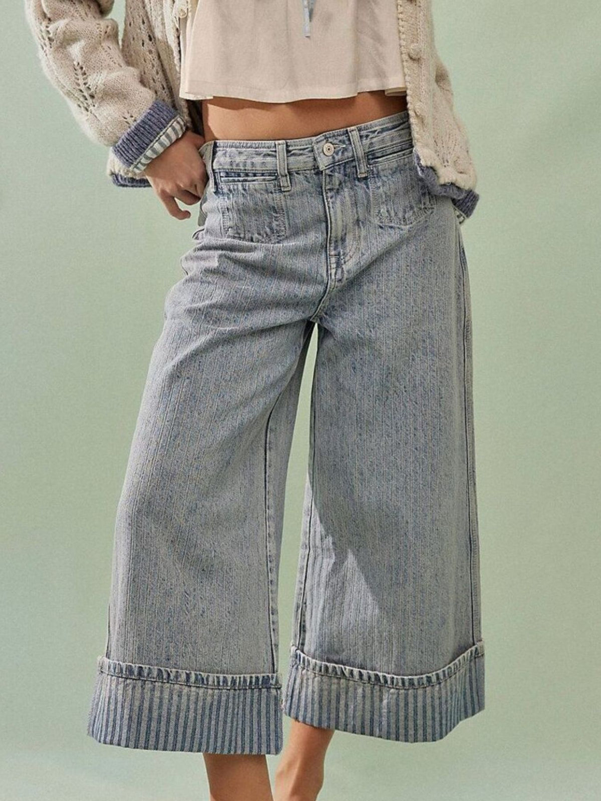 Light blue high-waisted cropped jeans with vertical pinstripe cuffs