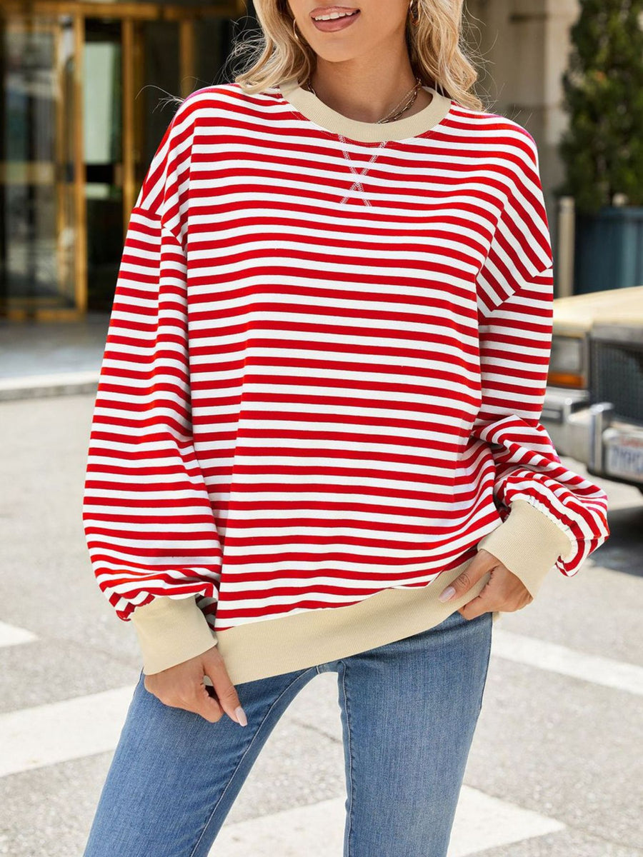 Red and white striped crew neck sweatshirt with beige trim and cuffs.