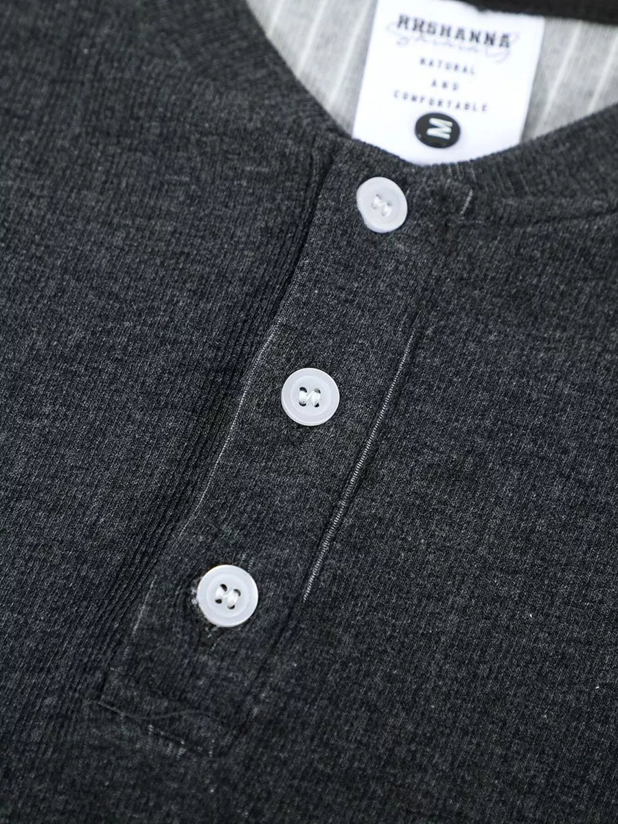 Men's dark gray textured ribbed henley t-shirt with three white buttons and a striped collar detail.