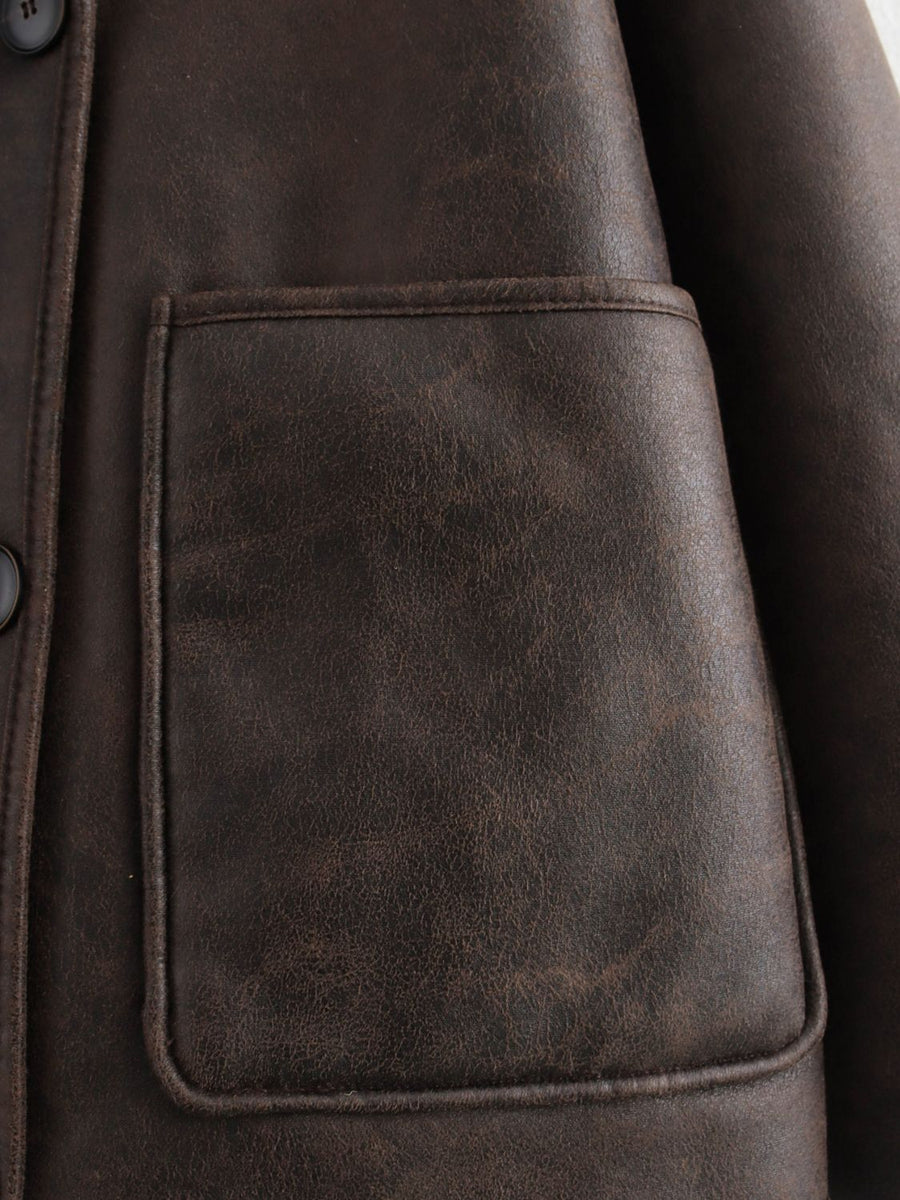 Chocolate aviator jacket with a patch pocket and button detail.