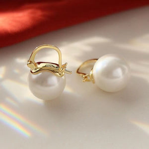 Gold plated pearl hoop earrings with a chic, classic design.