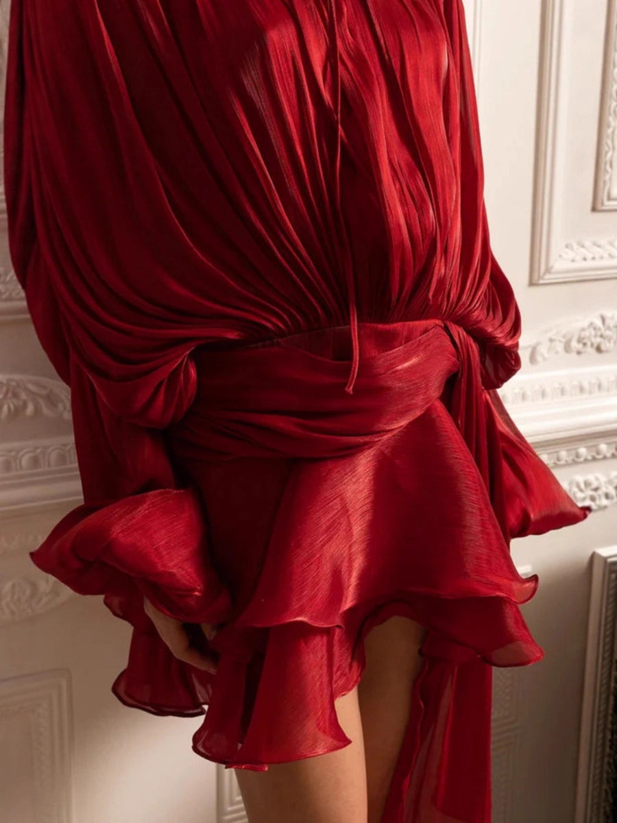 Red two-piece set with draped bodice, tied waist, and ruffled tiered skirt.