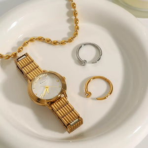 ring in gold featuring open design and fitted fit