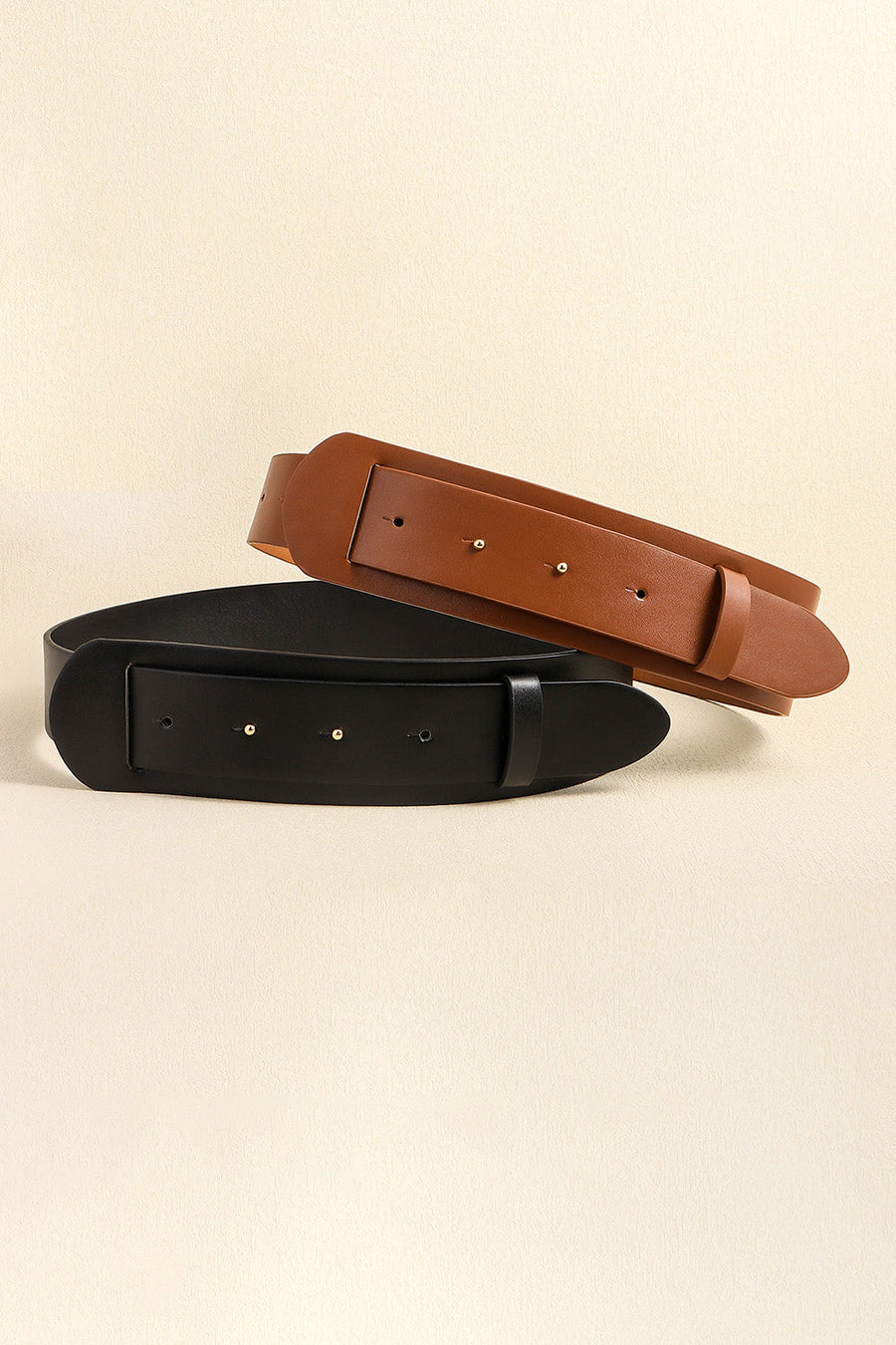Sculpted leather waist belts in black and caramel with adjustable buckle closure