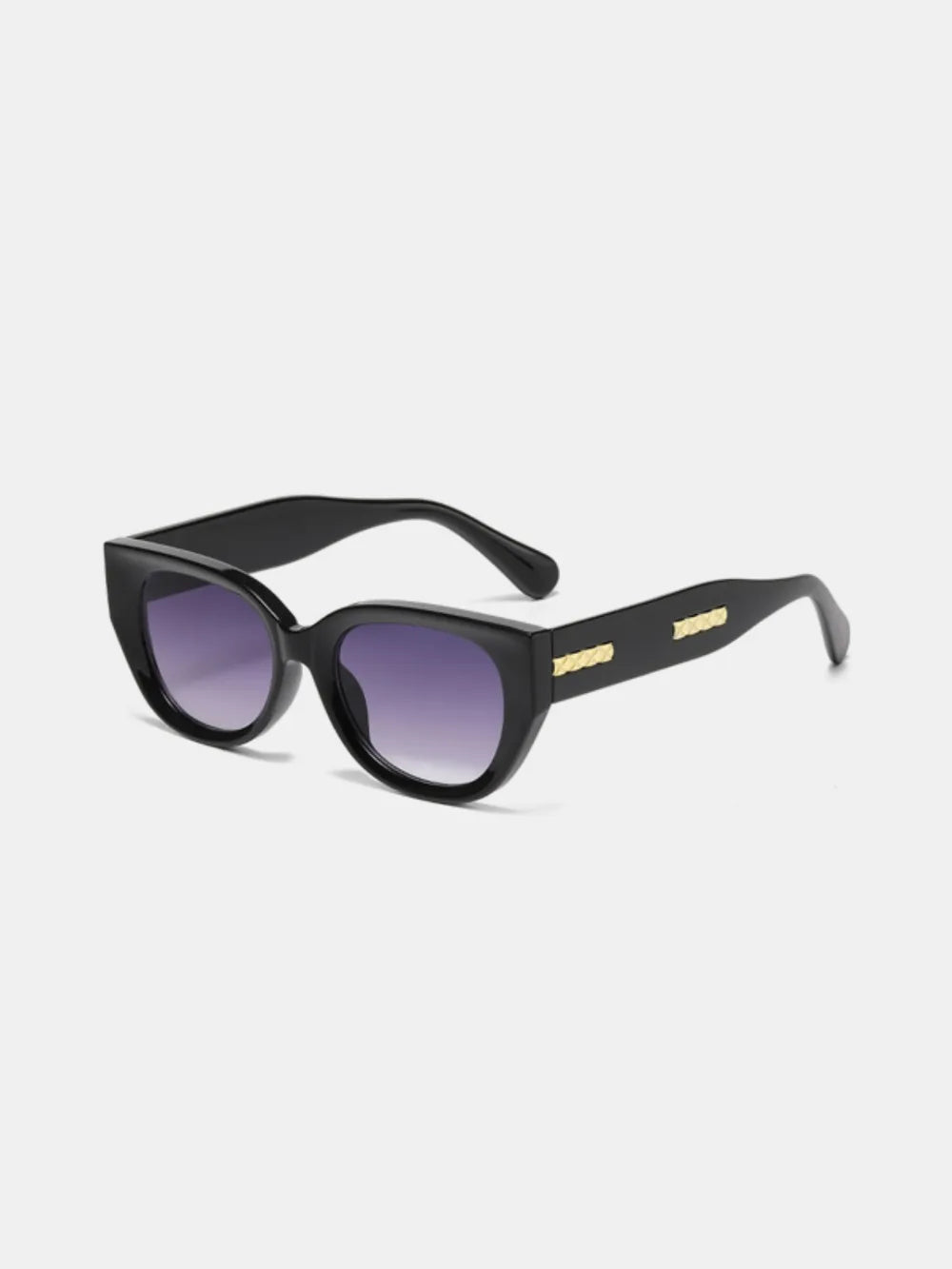 Black sculpted cat eye sunglasses with gold accent details and gradient lenses.