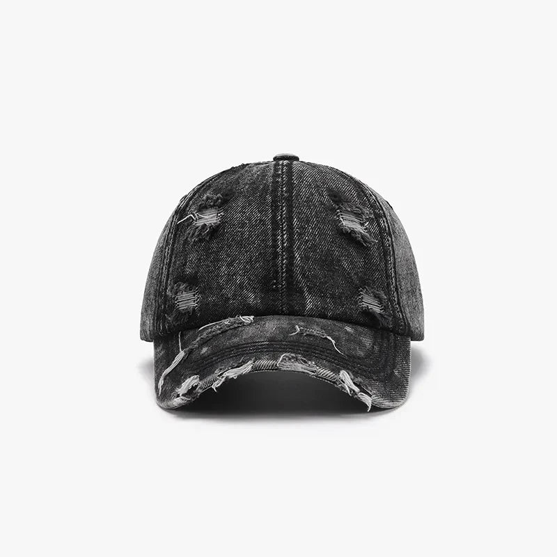 Black acid wash distressed denim baseball cap with frayed details.