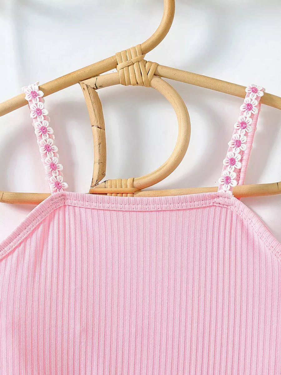 Pink ribbed cami with floral trim straps.