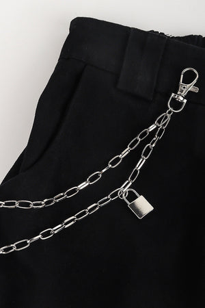Silver double chain pocket chain with padlock detail on black pants.