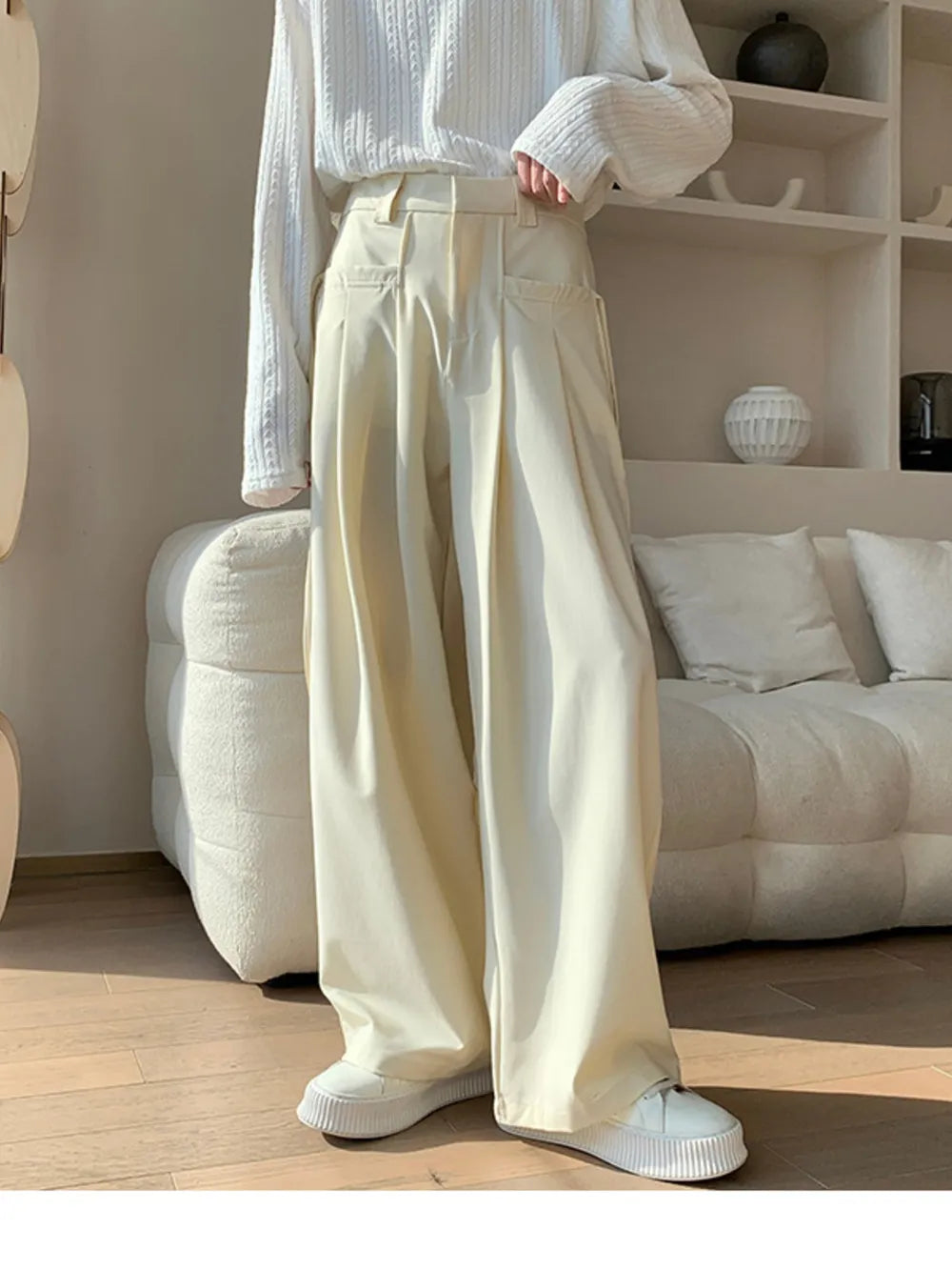 Men's cream wide-leg casual trousers with a relaxed fit and pleated front.
