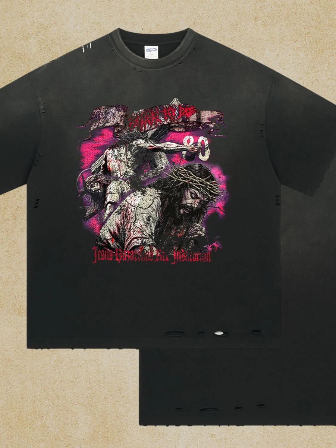 Black oversized ripped graphic tee with Jesus crucifixion print and distressed details.