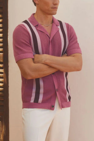 Striped knit polo shirt in red-violet with short sleeves and a spread collar.