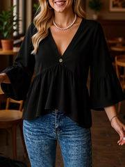 Black V-neck blouse with flounce sleeves and a single button detail.