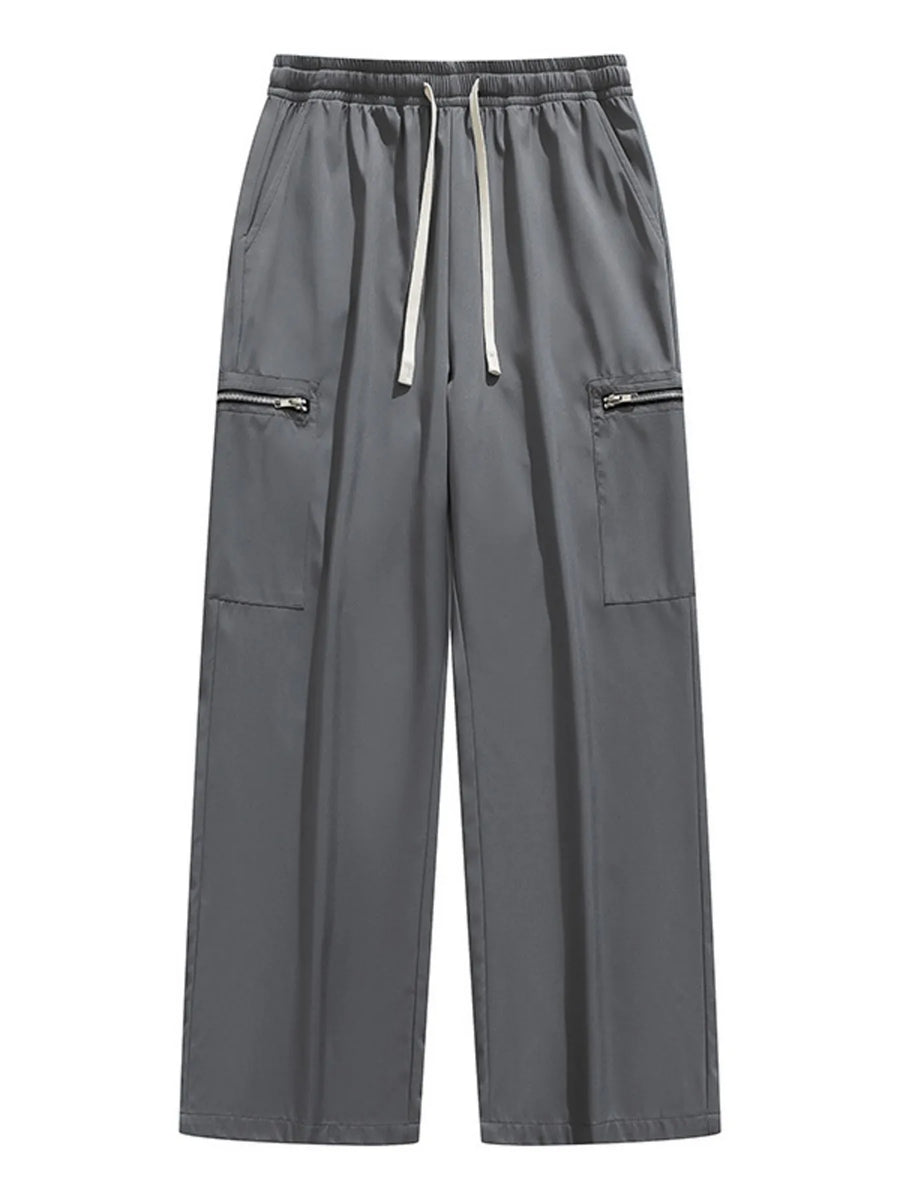 Dark gray wide-leg cargo pants with drawstring and zippered pockets.