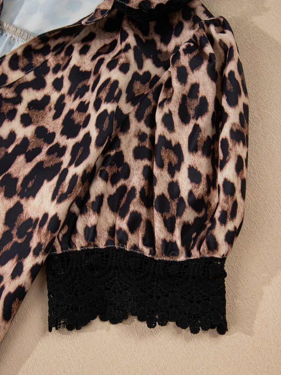 Women's leopard print shirt with black lace trim detail.