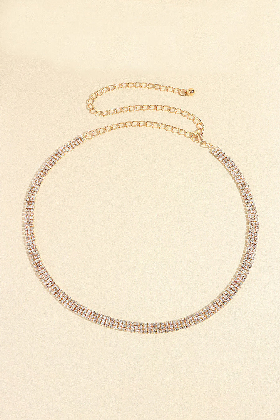 Gold triple-row crystal waist chain with adjustable link closure