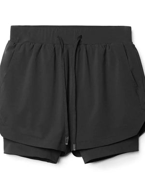 Black layered performance shorts with drawstring and perforated panels.