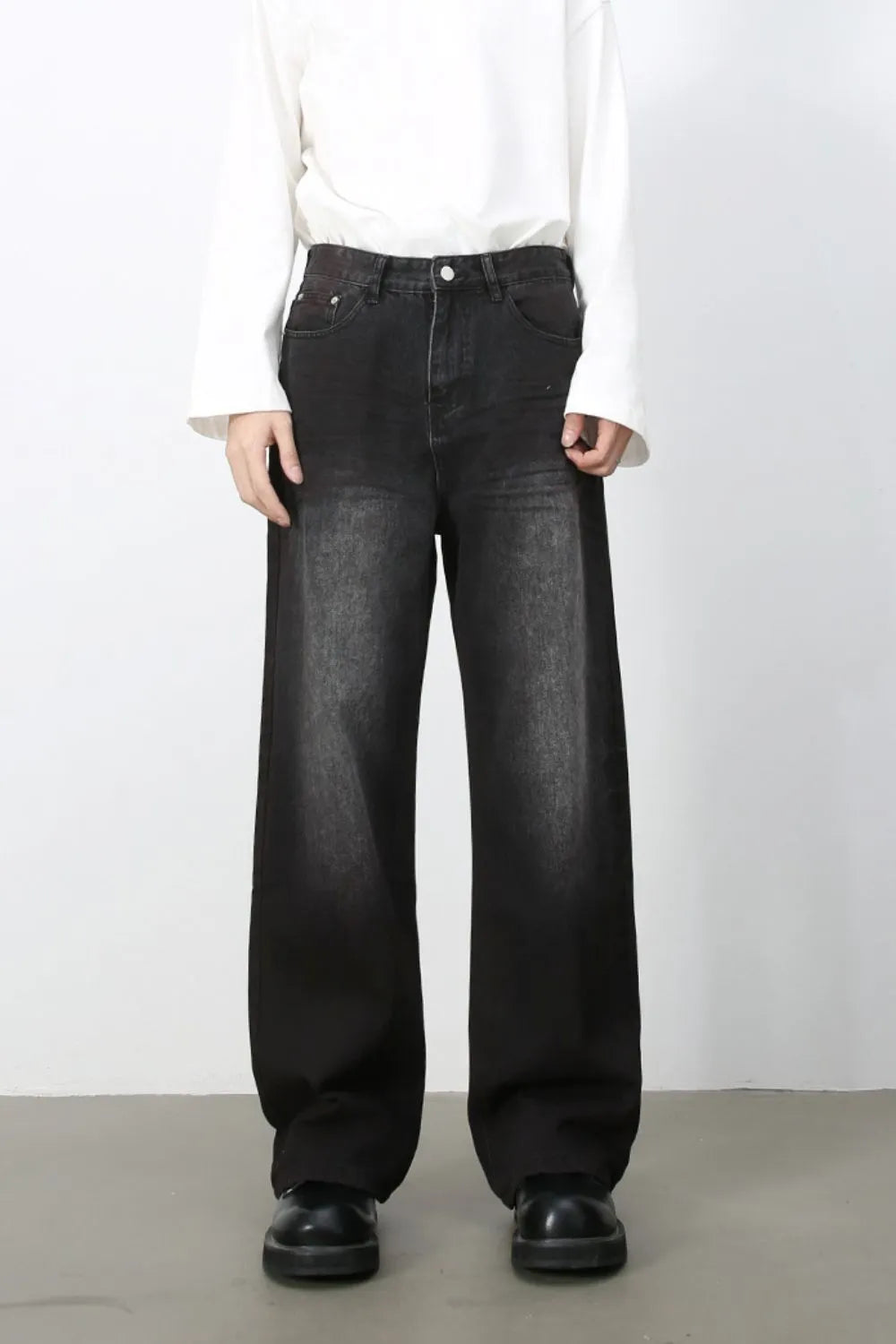 Faded dark wide-leg denim jeans with a casual, chic look.